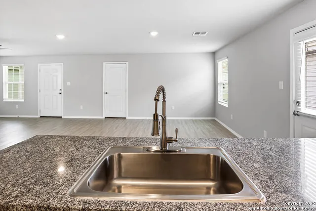 a kitchen with a sink and a window