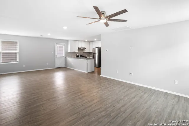 a view of a kitchen with a sink and a window