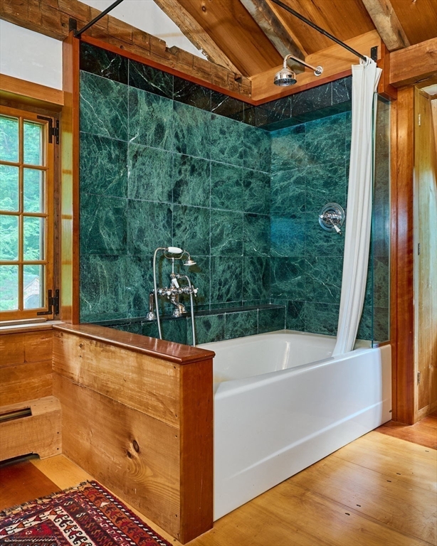 24 West Oxbow Road Charlemont, MA 01370 - Photo 17 of 29 a bathroom with a bathtub and shower