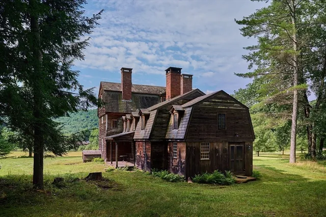 a view of house with yard