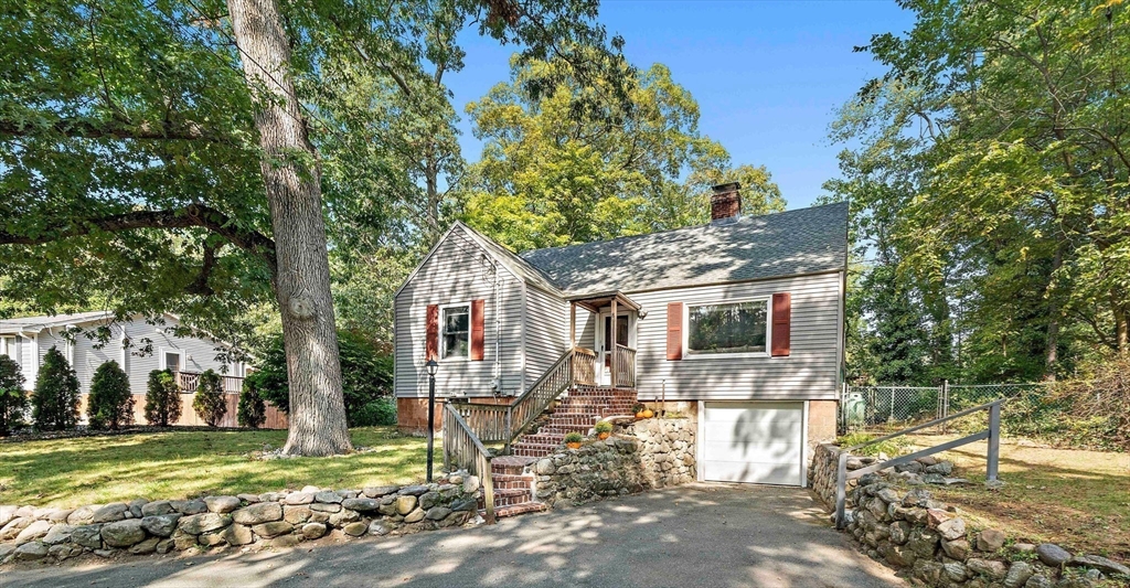 8 Elginwood Road Peabody, MA 01960 - Photo 22 of 25 a front view of a house with a yard