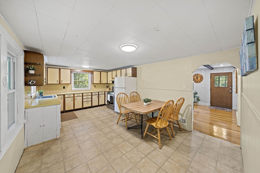 8 Elginwood Road Peabody, MA 01960 - Photo 5 of 25 a living room with furniture and view of kitchen