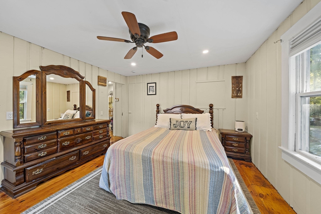 8 Elginwood Road Peabody, MA 01960 - Photo 7 of 25 a bedroom with a bed and wooden floor