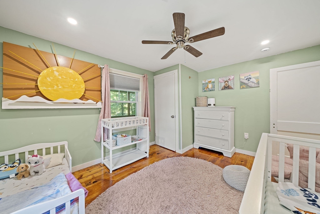 8 Elginwood Road Peabody, MA 01960 - Photo 10 of 25 a bedroom with a bed and wooden floor