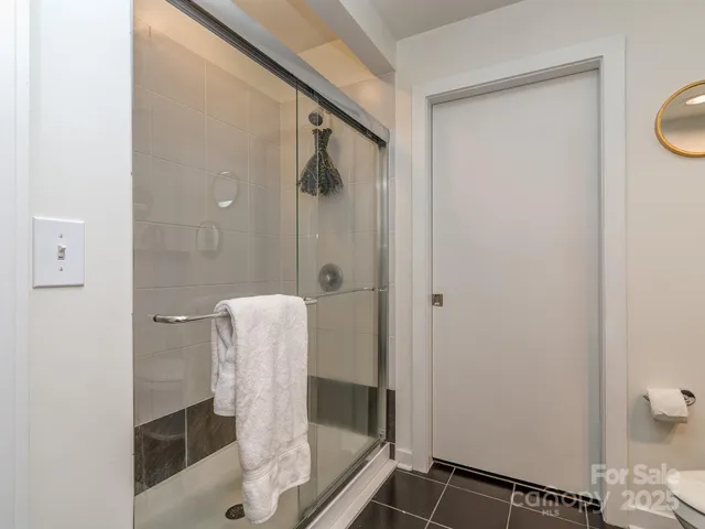 a bathroom with a shower and a sink