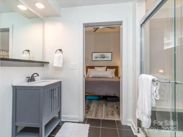 a en suite bathroom with a toilet sink and mirror