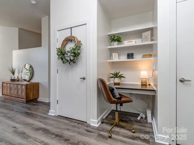a workspace with furniture and wooden floor