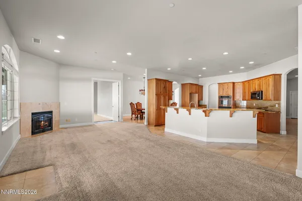 a view of a dining room with furniture and chandelier