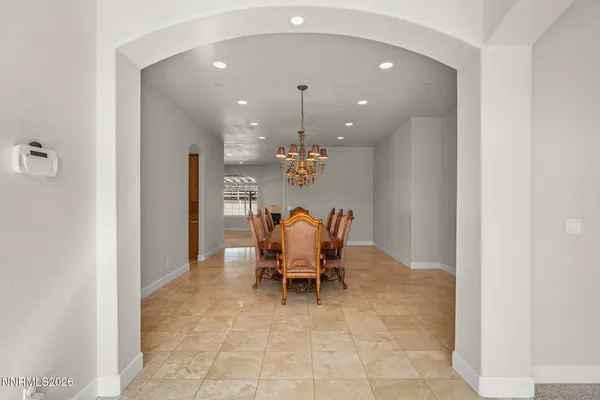 a view of an empty room and a window