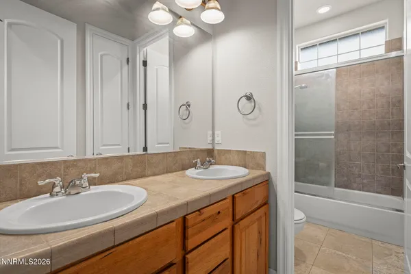 a living room with furniture and flat screen tv