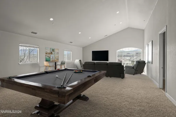 a room with gym equipment and a table