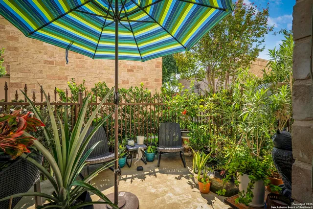 a view of a chair and tables in the backyard
