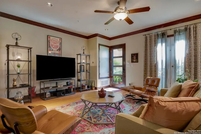 a living room with furniture and a flat screen tv