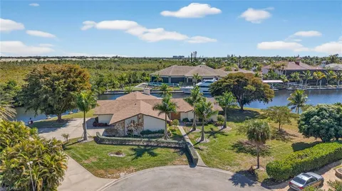 an aerial view of a house with lake view