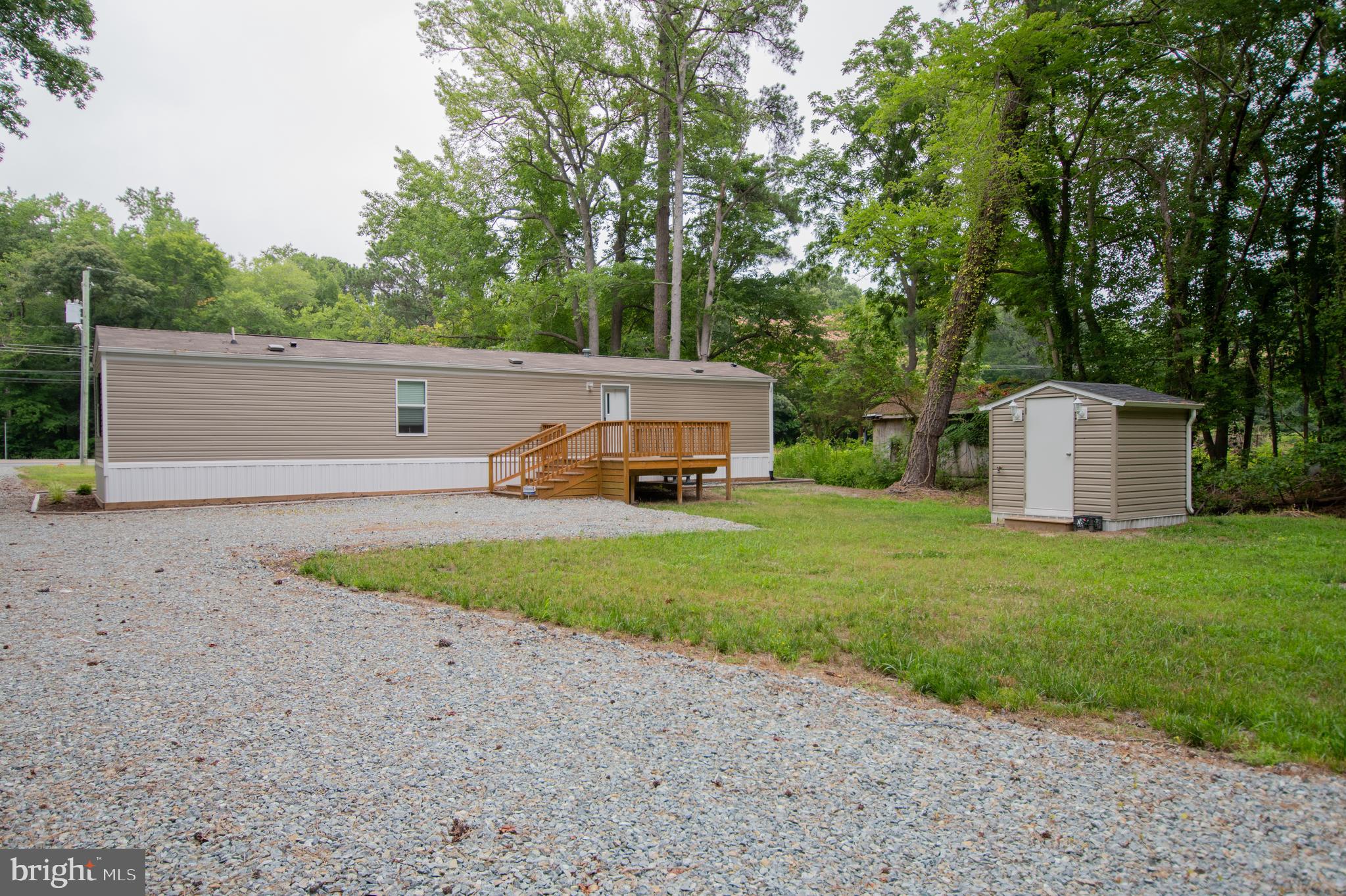 21449 Nanticoke Road Tyaskin, MD 21865 - Photo 13 of 14 a house view with a garden space