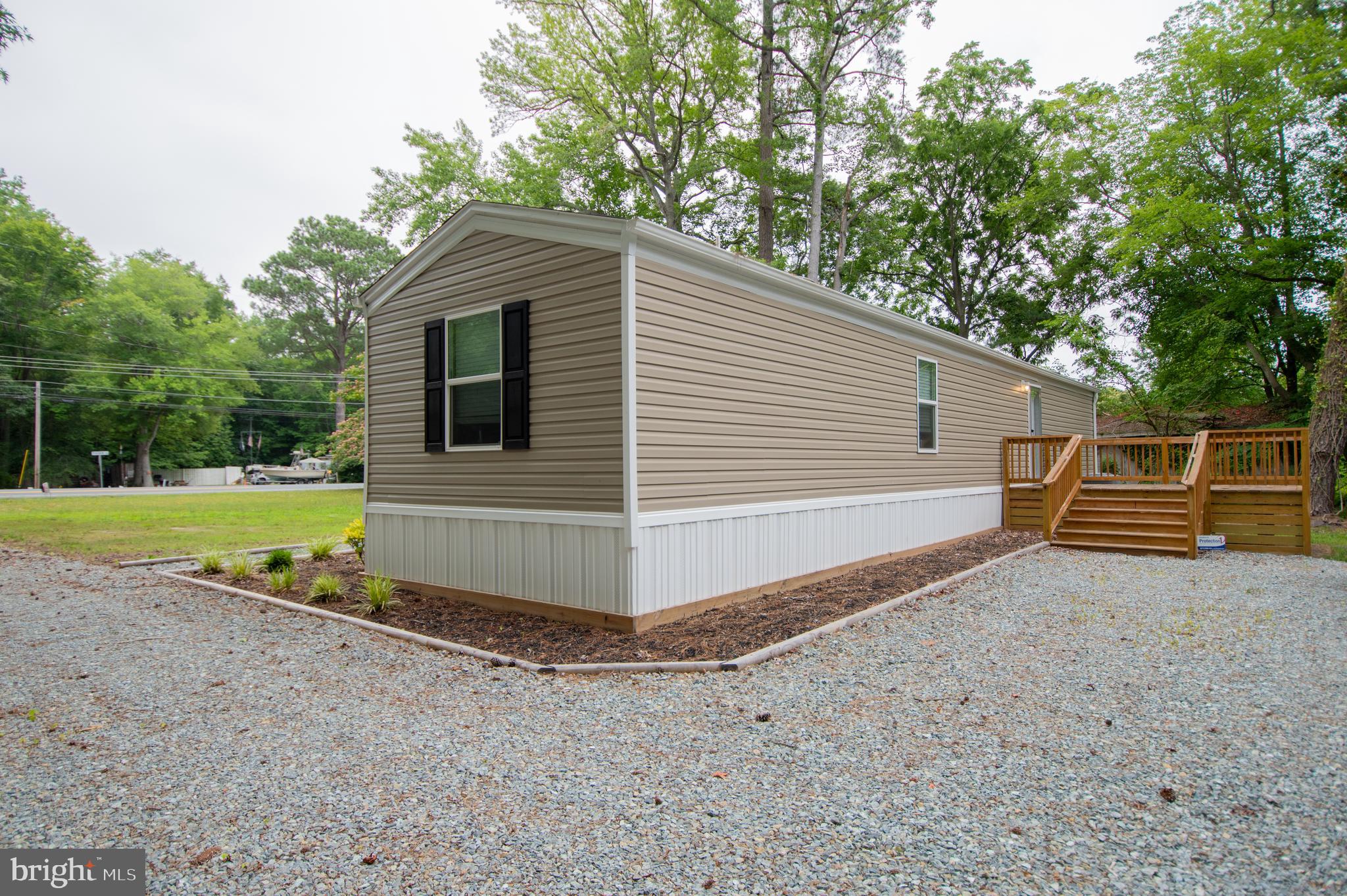 21449 Nanticoke Road Tyaskin, MD 21865 - Photo 2 of 14 a view of backyard with swimming pool and seating area