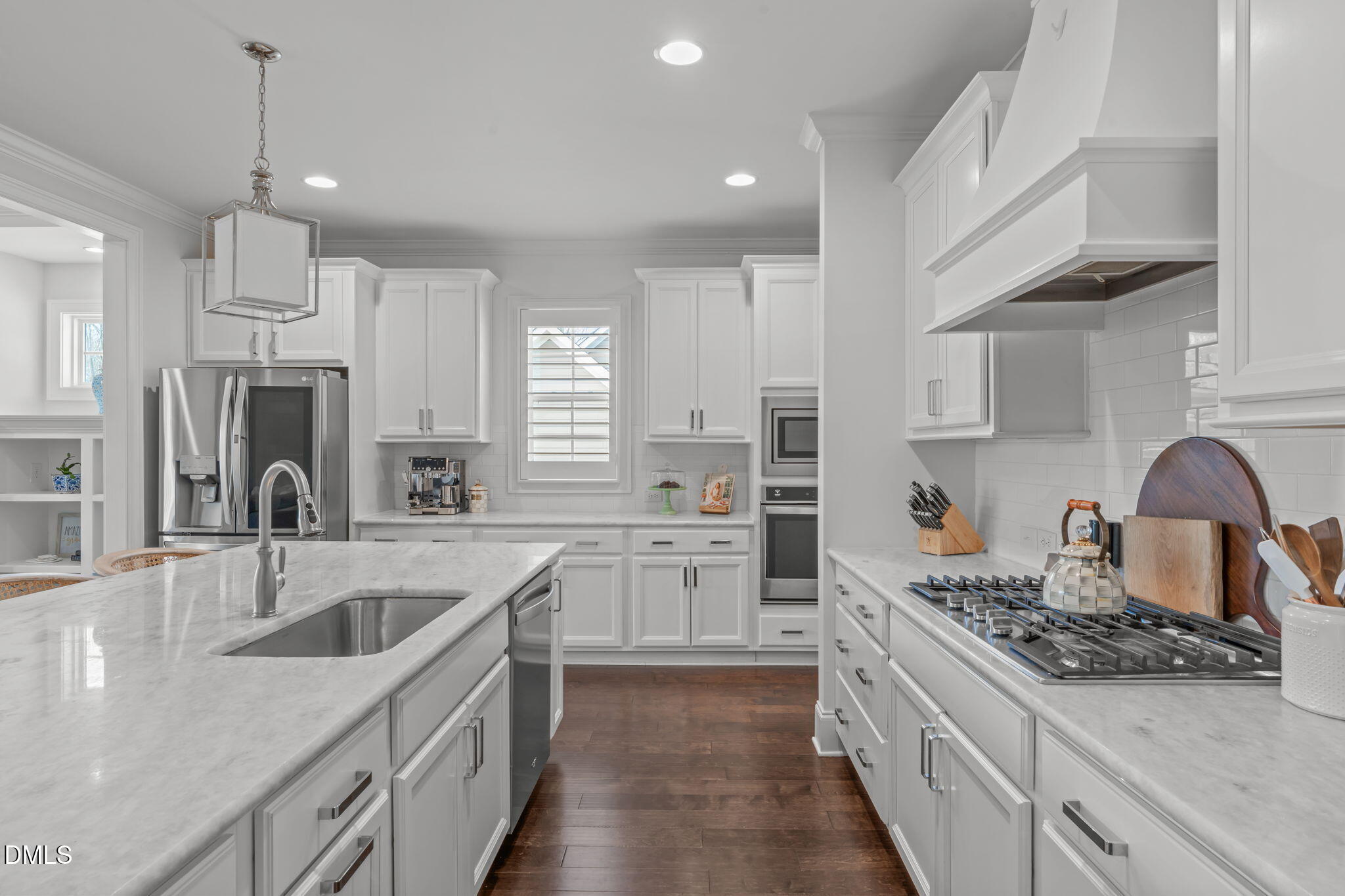 4144 Olde Judd Drive Willow Spring, NC 27592 - Photo 9 of 52 a kitchen with a sink stove top oven and refrigerator