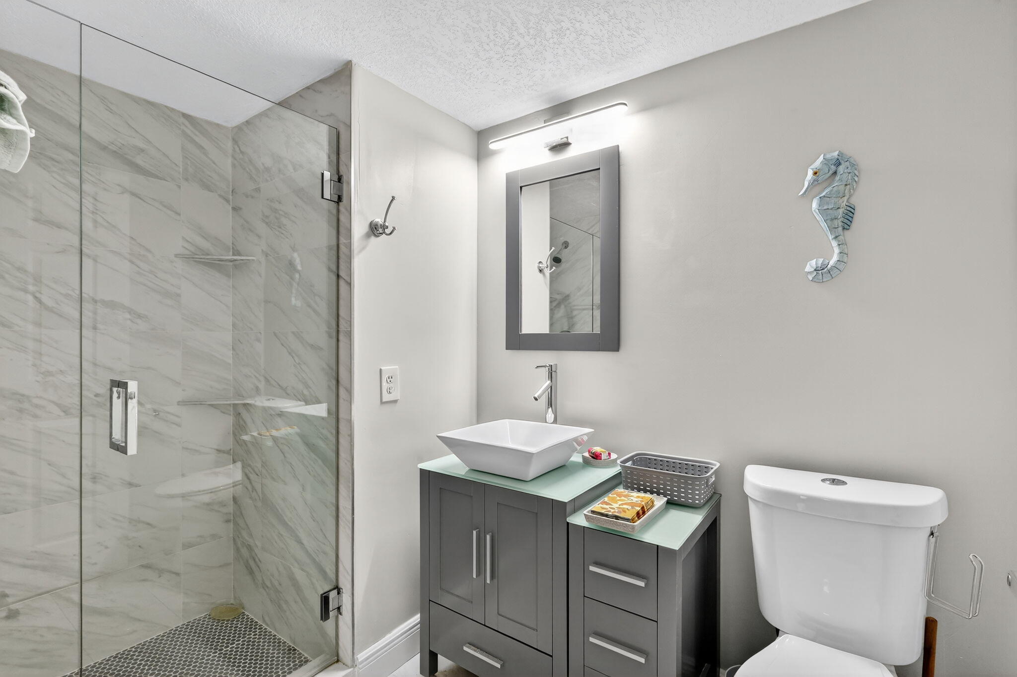 36 Southport Lane, Unit C Boynton Beach, FL 33436 - Photo 23 of 69 a bathroom with a toilet sink and mirror