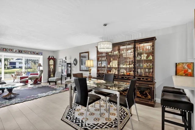 a view of a lake with a yard and outdoor seating