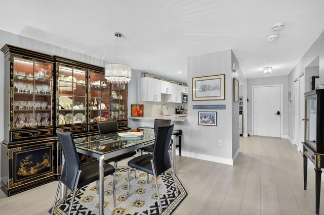 an aerial view of a house with a garden and lake view