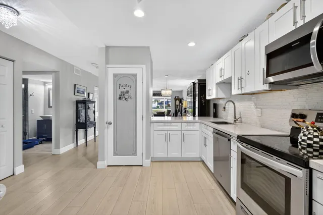 a bedroom with furniture and a wooden floor