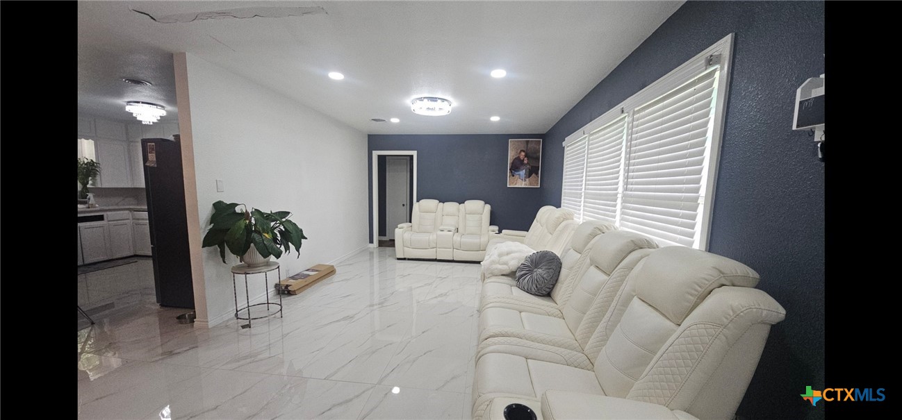 1901 South 33rd Street Temple, TX 76504 - Photo 4 of 20 Stunning 2'x4' porcelain tile flooring. Extremely durable, water resistant and low maintenance.