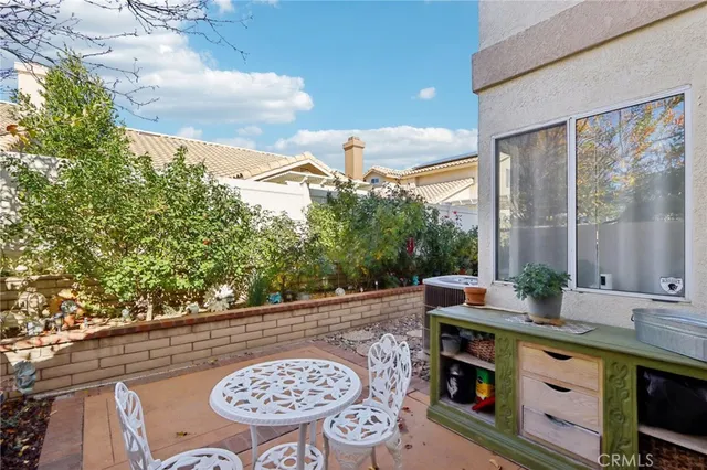 a view of a chairs and table in a patio