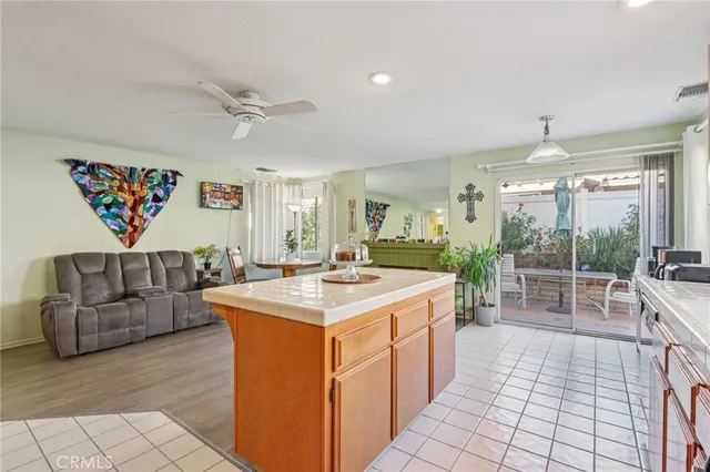a large white kitchen with a large window