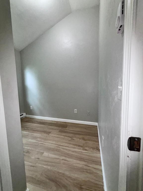 26 Main Street, Unit 2 Spencer, MA 01562 - Photo 10 of 12 a view of an empty room with wooden floor
