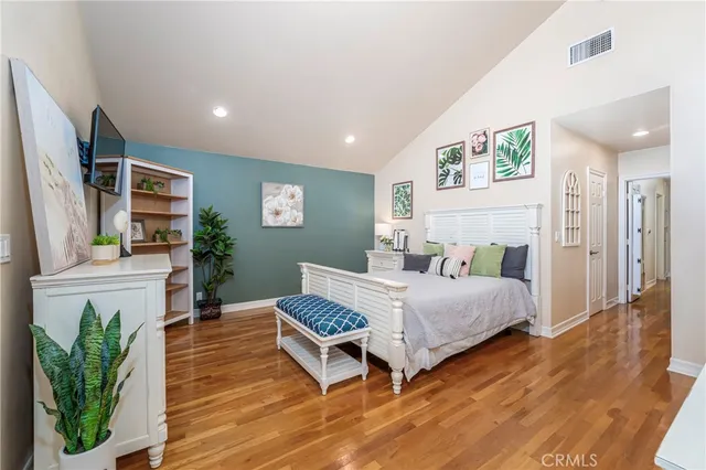 a bedroom with a bed and a fireplace