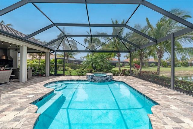 a view of indoor pool and deck