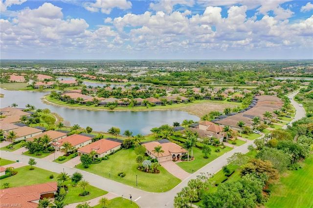 a view of a lake with houses in the back