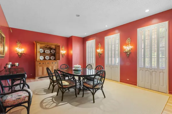 a dining room with furniture and window