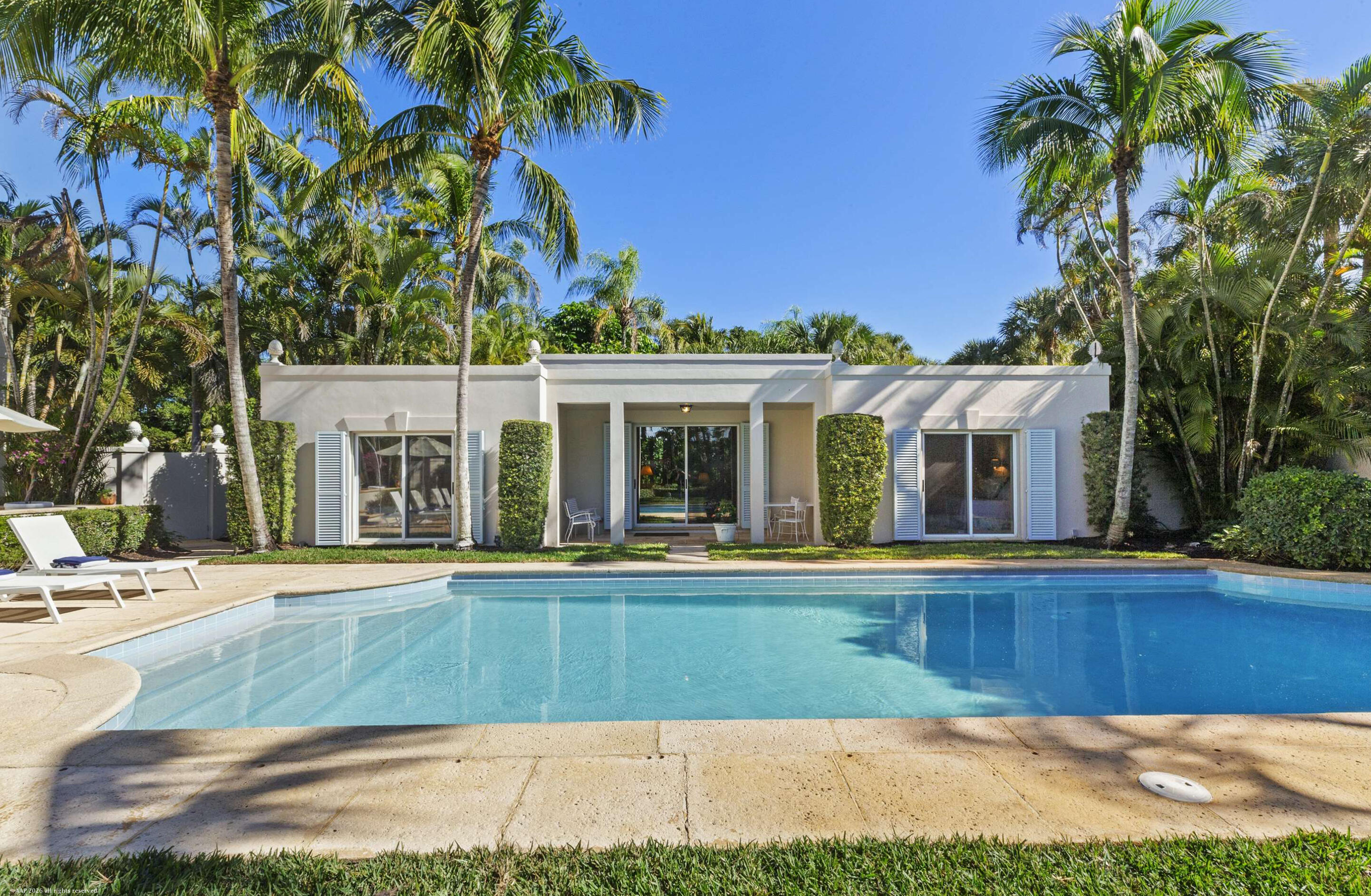 30 Gomez Road Jupiter Island, FL 33455 - Photo 21 of 30 a view of a house with a swimming pool and sitting area