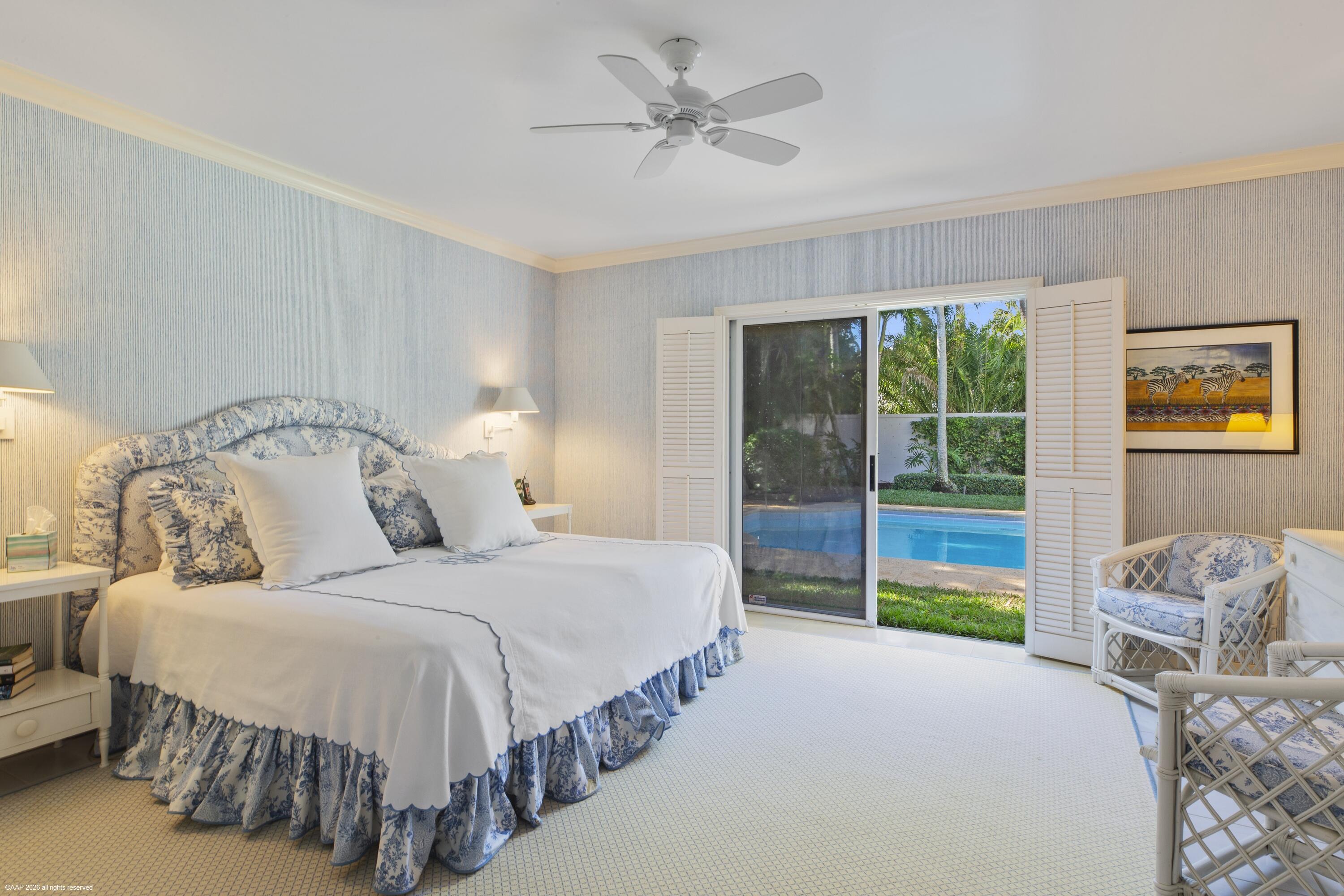 30 Gomez Road Jupiter Island, FL 33455 - Photo 24 of 30 a bedroom with a bed and a chandelier