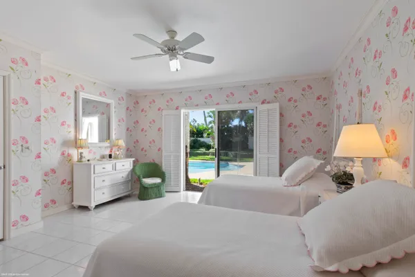 a bed room with a bed and a chandelier