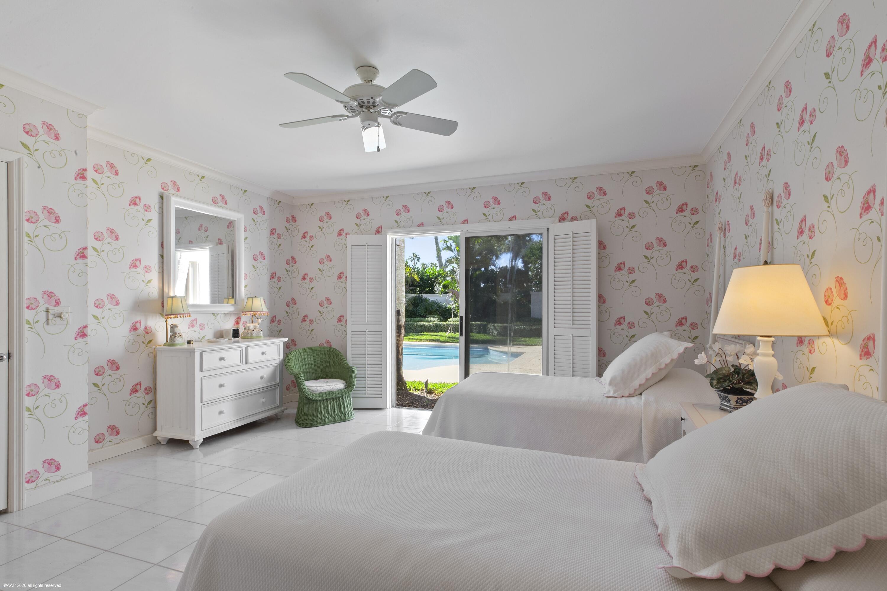 30 Gomez Road Jupiter Island, FL 33455 - Photo 25 of 30 a bed room with a bed and a chandelier