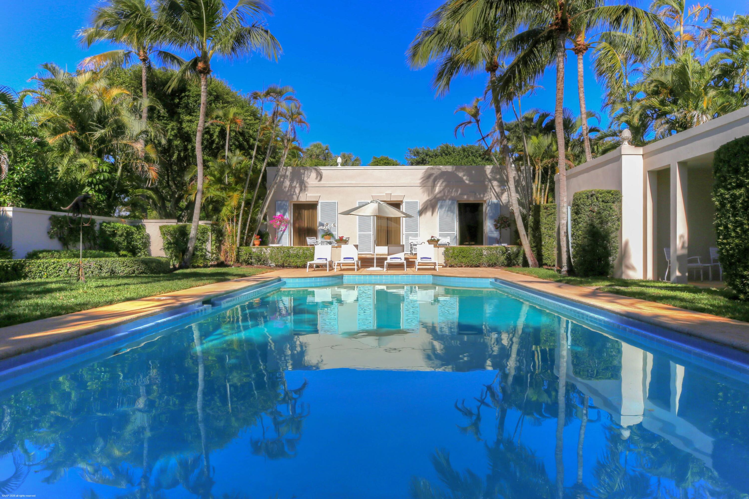 30 Gomez Road Jupiter Island, FL 33455 - Photo 26 of 30 a view of house with swimming pool outdoor seating