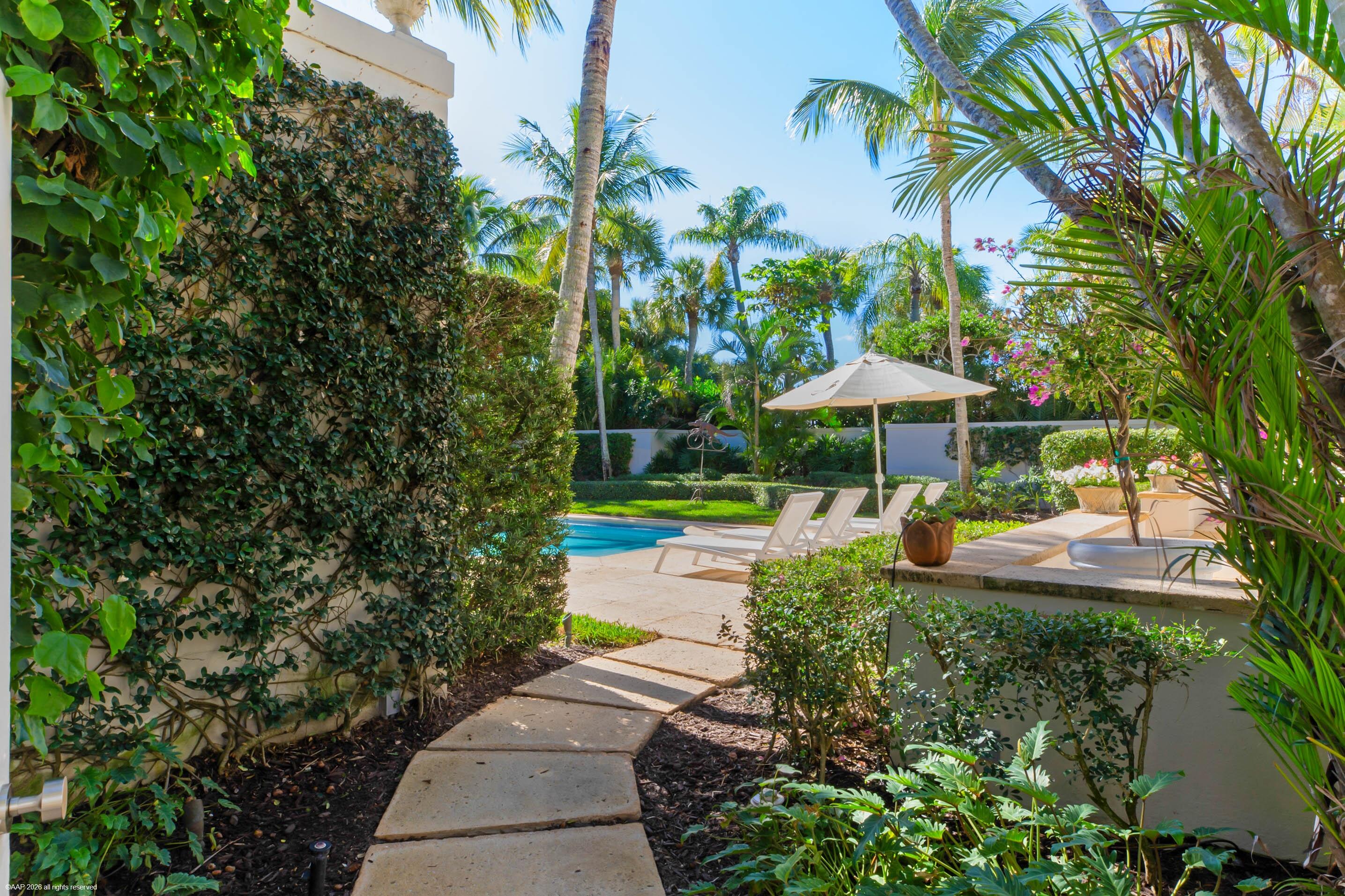 30 Gomez Road Jupiter Island, FL 33455 - Photo 27 of 30 a front view of a house with garden and patio