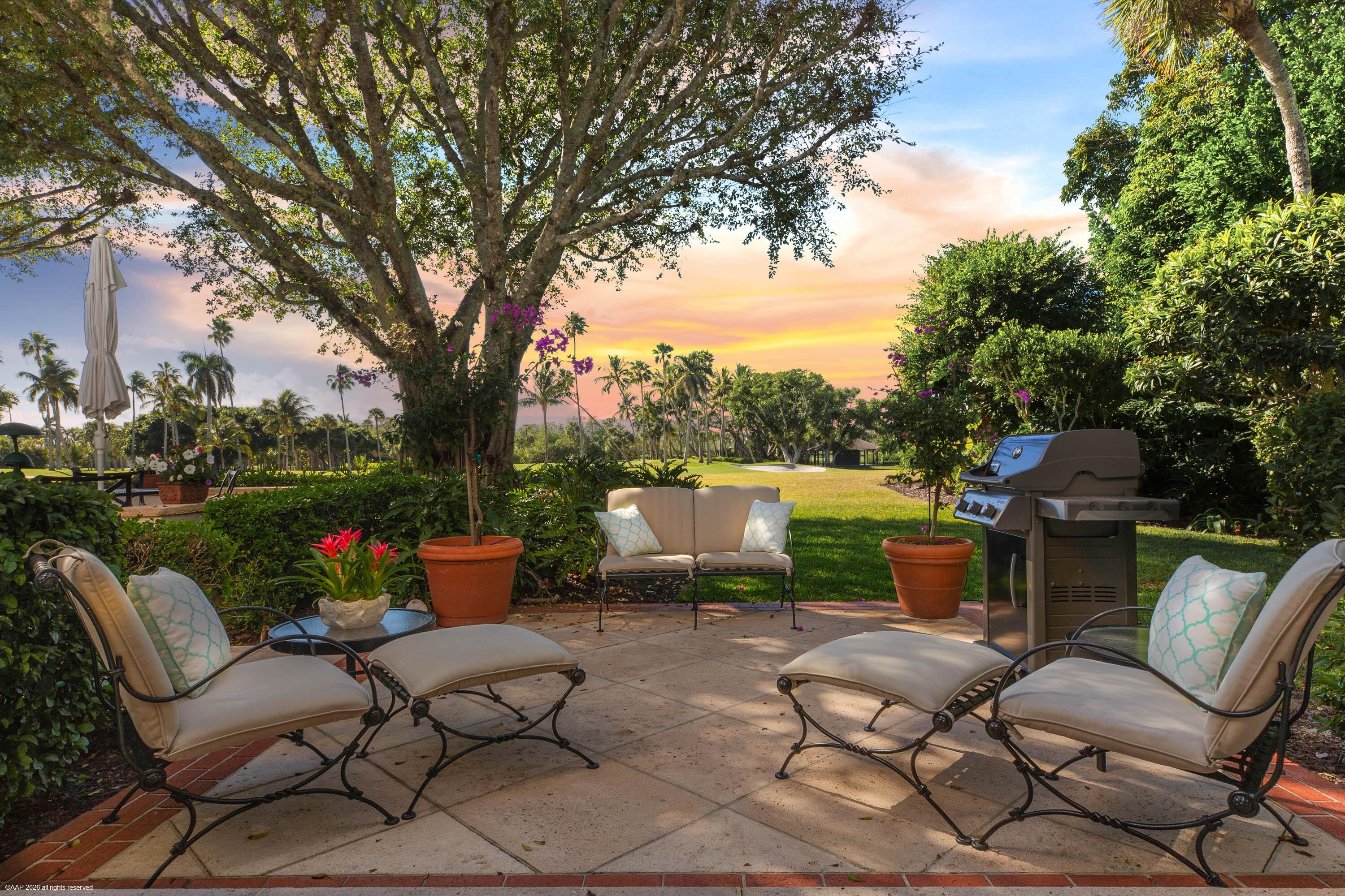 30 Gomez Road Jupiter Island, FL 33455 - Photo 30 of 30 a view of a patio with couches chairs and a fire pit
