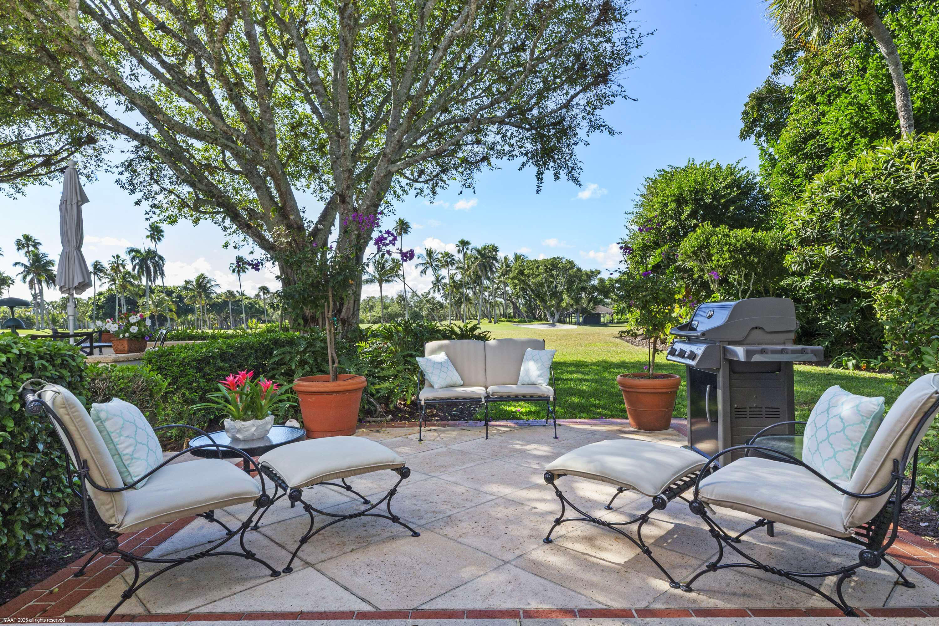30 Gomez Road Jupiter Island, FL 33455 - Photo 9 of 30 a view of a chairs and table in the garden