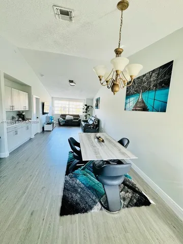 a view of a living room and hardwood floor