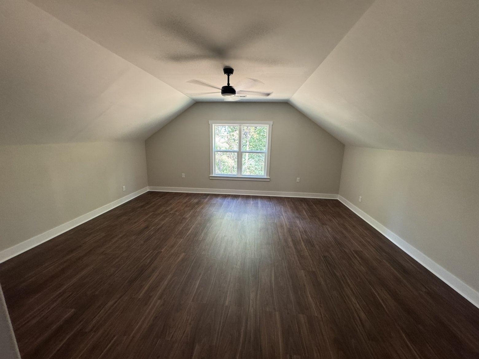 3540 Portersville Road Atoka, TN 38004 - Photo 26 of 37 Spacious room featuring wood-finish flooring, a single window, and a ceiling fan