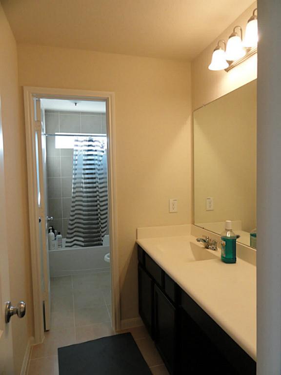 7326 Granite Terrace Lane Houston, TX 77083 - Photo 27 of 39 a bathroom with a sink and a mirror