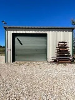 a view of ocean with large trees