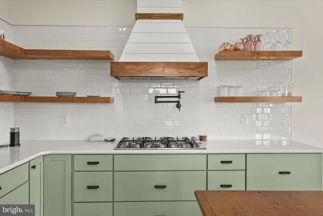 a kitchen with a cabinets and window