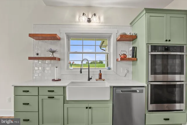 a kitchen with a sink and cabinets