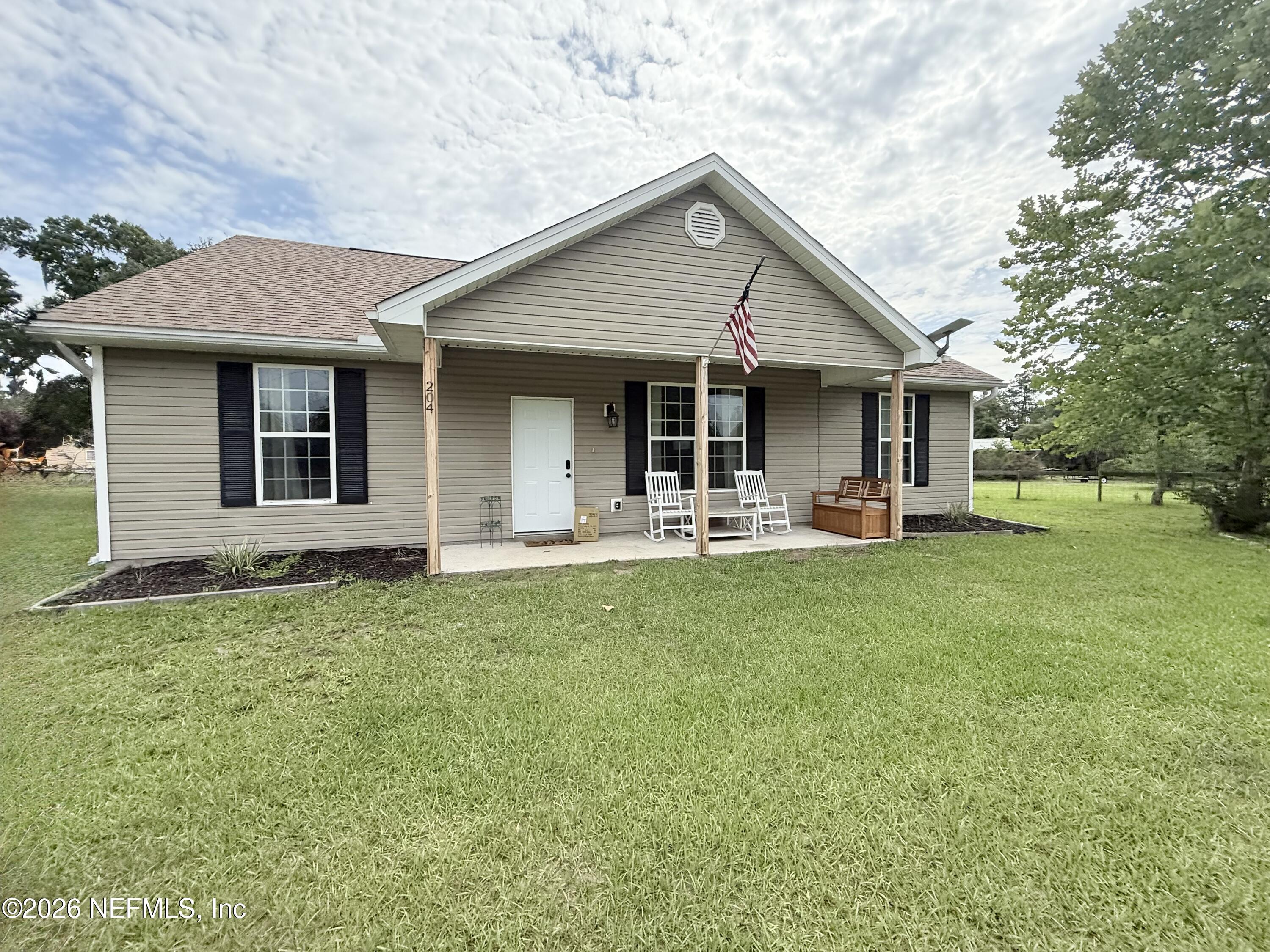 204 Comer Road Palatka, FL 32177 - Photo 2 of 15 a house view with a garden space