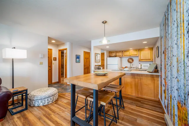 a dinning room with a table and chairs