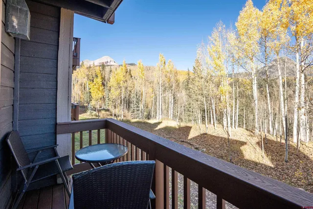 a view of a balcony with furniture